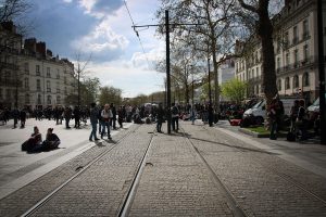 Students Blocking The Tram