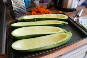 Scooped out Courgettes on baking tray